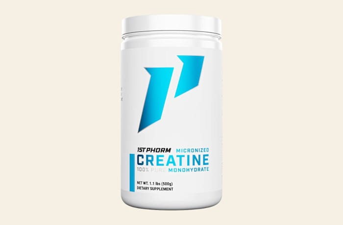 A white cylindrical container of 1st phorm micronized creatine monohydrate